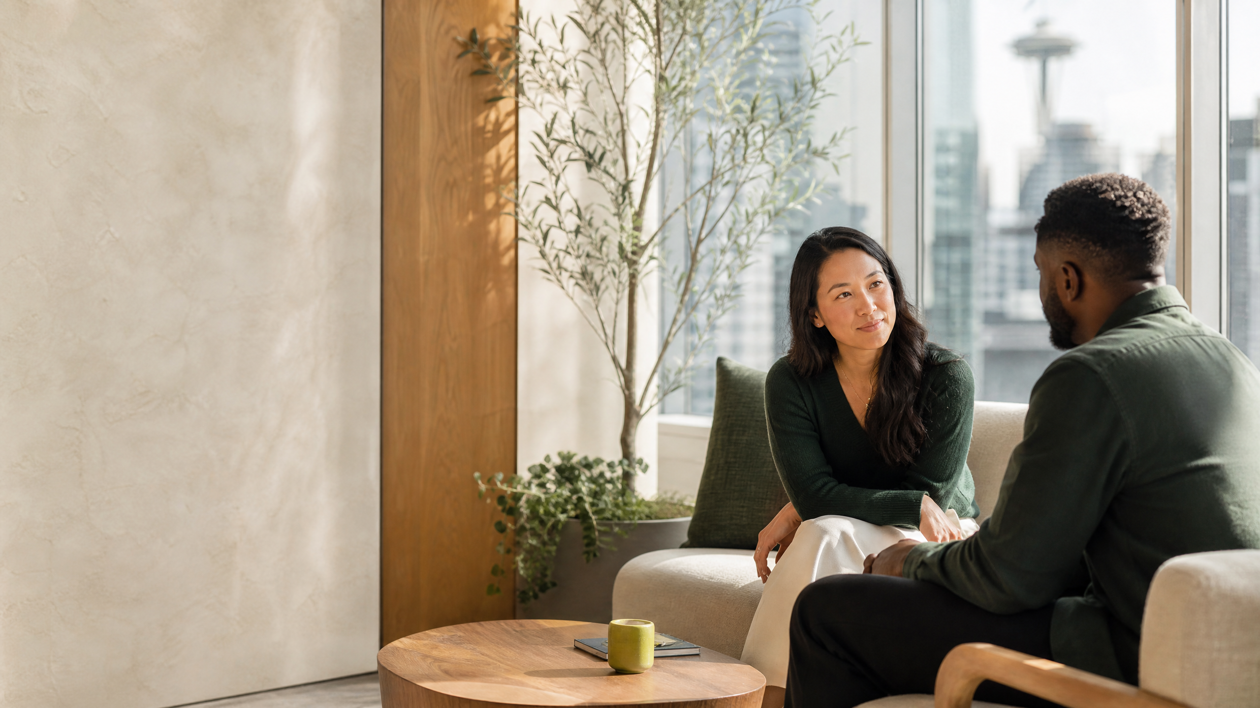 Two colleagues sharing a thoughtful one-to-one conversation